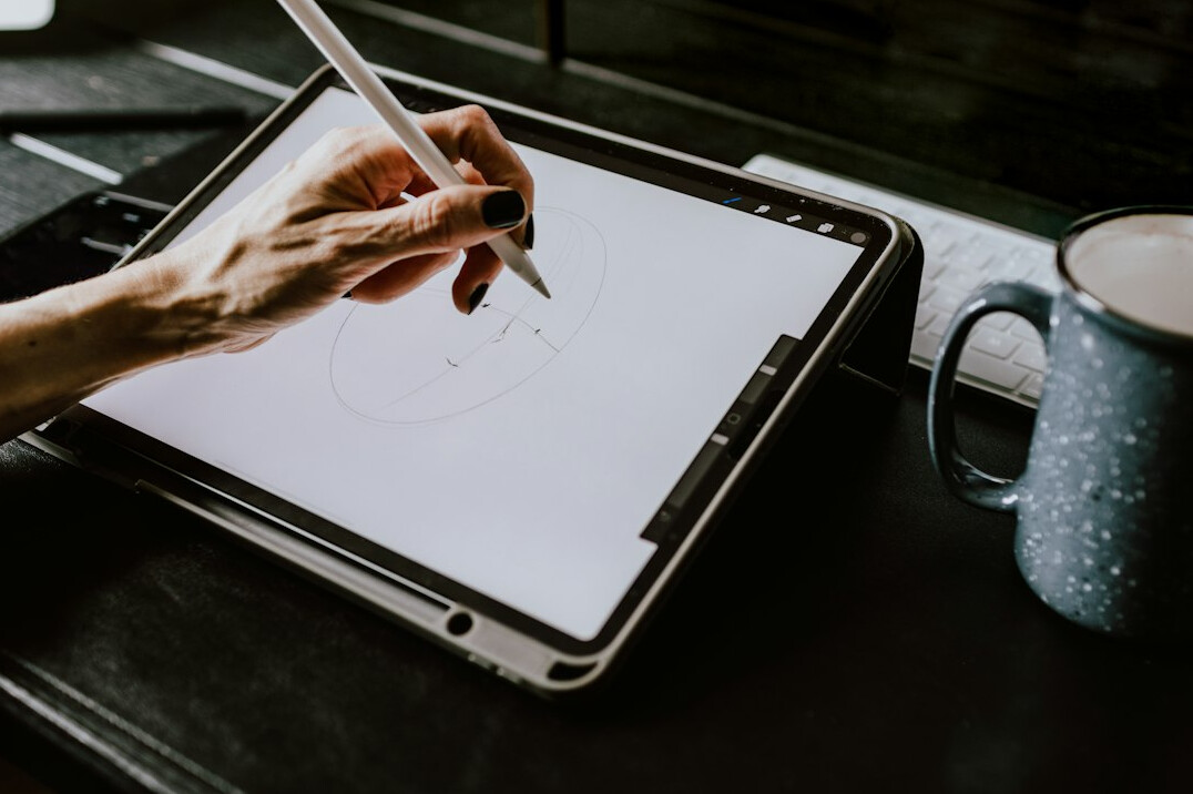 person using digital tablet
